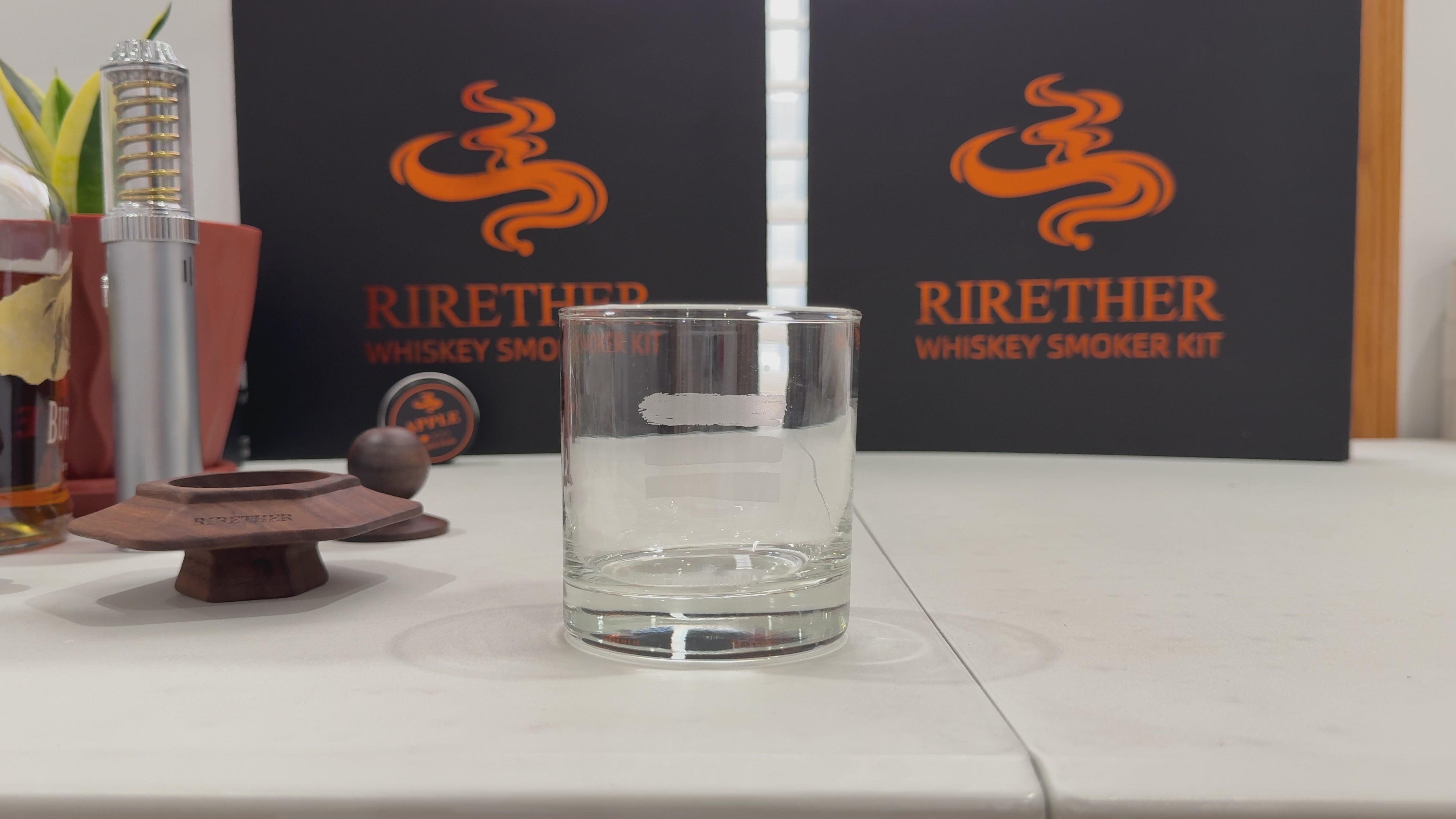 Dense aromatic smoke flowing into a crystal whiskey glass from a North American Black Walnut smoker top.