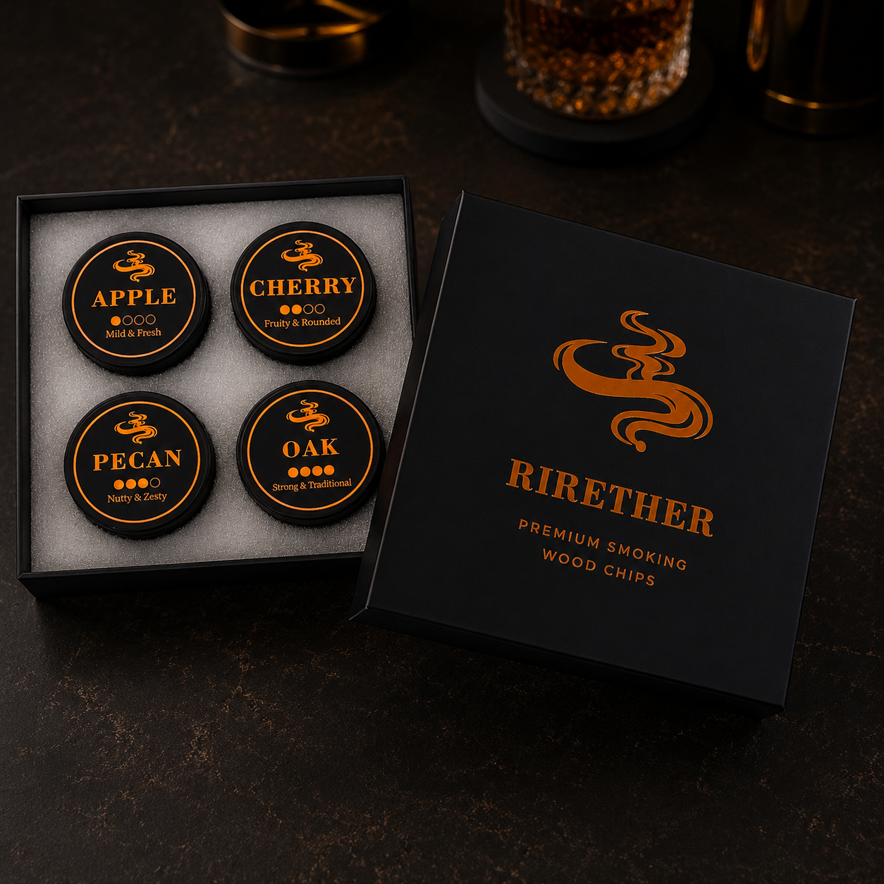 RIRETHER premium smoking wood chips 4-flavor variety pack in a luxury black gift box with Amber Copper foil logo. Features round tins of Apple, Cherry, Pecan, and Oak wood chips on a cinematic dark bar counter for cocktail smoking.